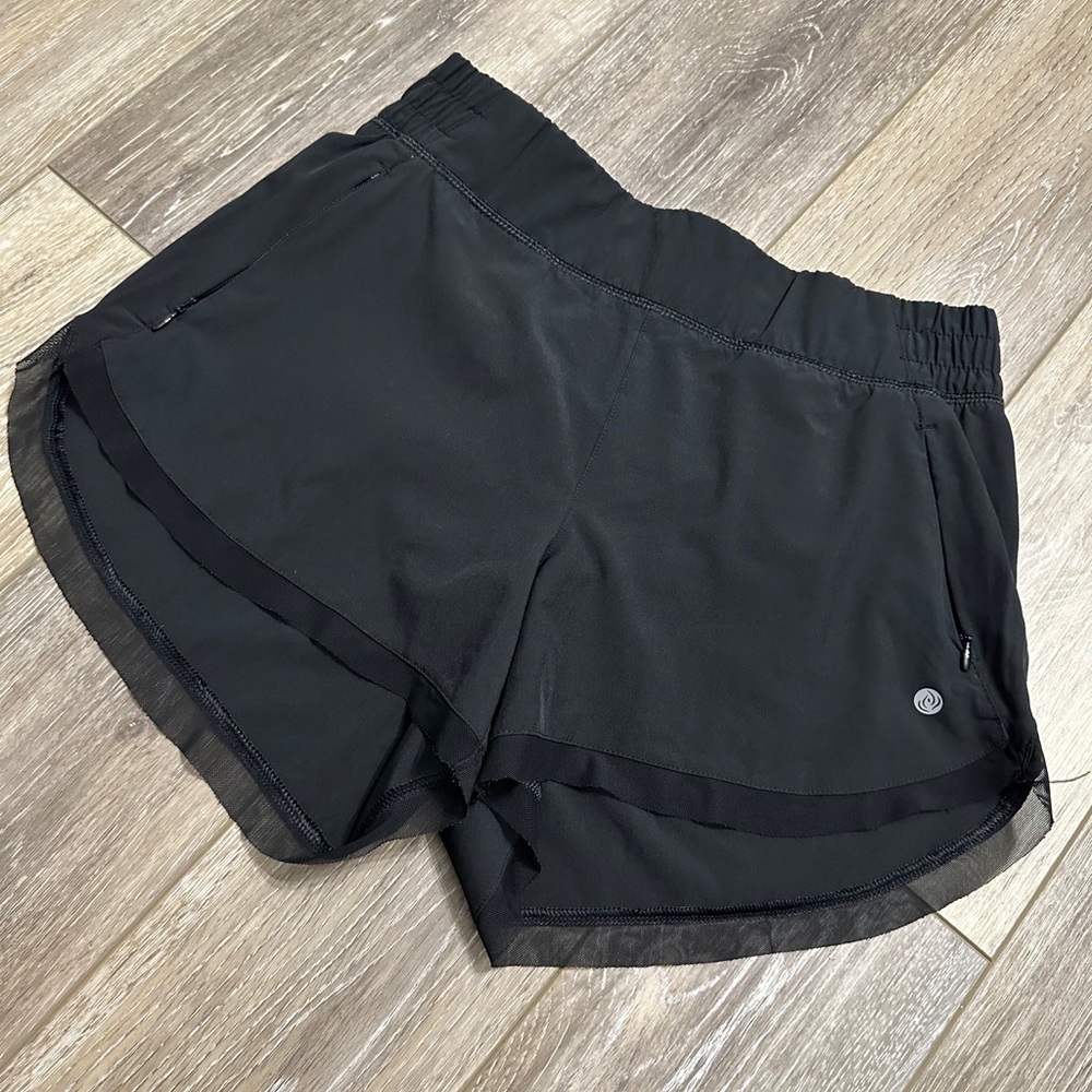 Alana black Athletic shorts with mesh trim bottom and zipper pockets Size S